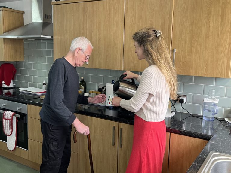 Professional Carers Network carer image of elderly client and family Professional Carers Network carer image of elderly client and family